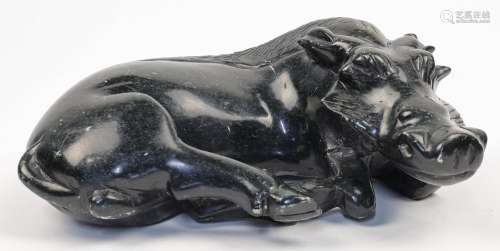 A carved hardstone figure of a recumbent wild boar, 20th cen...