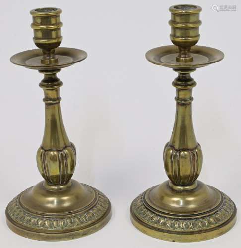 A pair of gilt bronze candlesticks, 18th century, the balust...