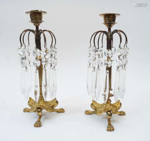A pair of Regency style brass candlestick lustres with facet...
