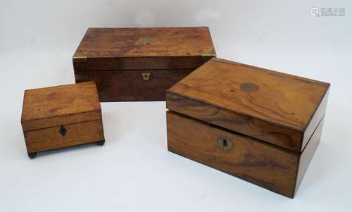 Two Victorian walnut brass bound writing boxes, the larger w...