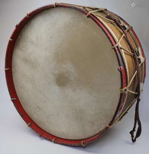 A large Edwardian circus drum, c.1910, with red painted hoop...