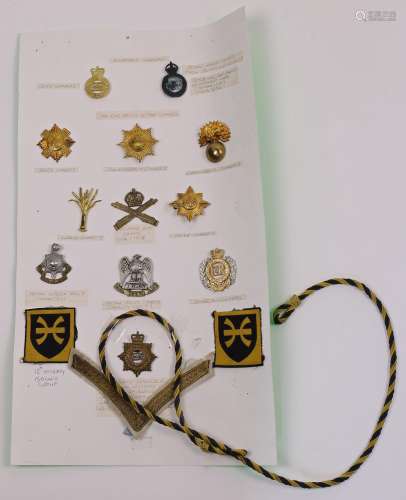 A collection of gilt-metal sixteen Army Service cap badges, ...