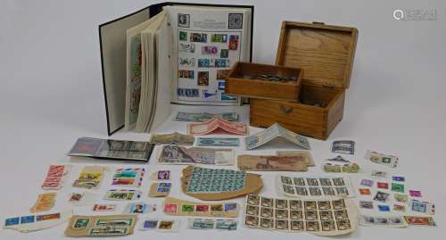 A quantity of stamps and currency, to include a small collec...
