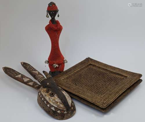 A collection of tribal items, comprising: an African anthrop...