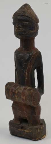 A West African carved hardwood figure, 20th century, modelle...