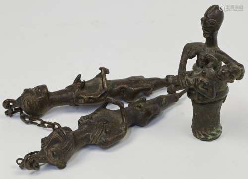 A pair of Ogoni bronze ceremonial wedding ornaments, modelle...