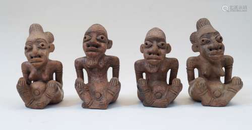 A group of four seated terracotta figures, Nigeria, 20th cen...