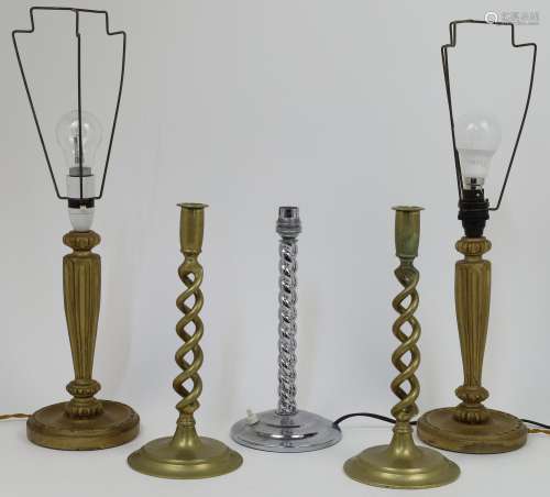 A group of lighting and candlesticks, to include a pair of b...