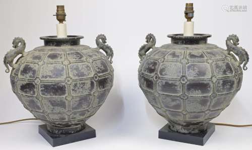 A pair of metal globular urn shaped table lamps, 20th centur...