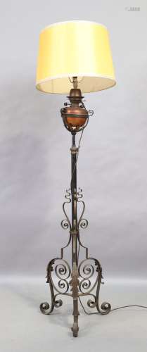 A wrought iron and copper standard lamp, last quarter 19th c...