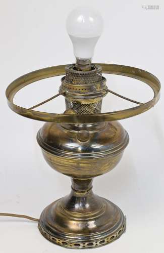 A brass standard lamp, early 20th century, with oil burned a...