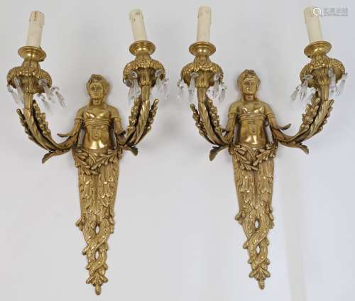 A pair of French Empire style gilt metal twin light wall app...