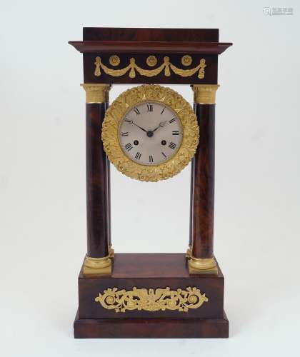 A French gilt-bronze mounted mahogany veneered portico clock...