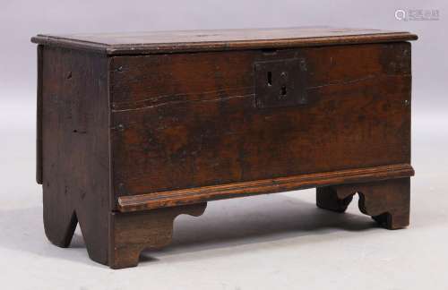 An English oak table top six plank coffer, 17th century, 35c...