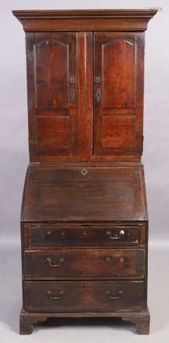 An English oak bureau bookcase, 18th century and later, the ...