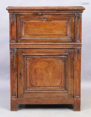 An English oak cabinet, 18th century, the fall front top enc...