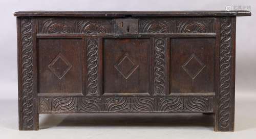 An English oak coffer, second quarter 18th century, carved f...
