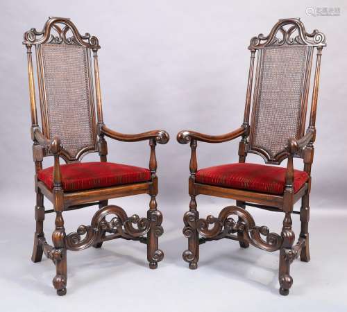 A pair of Jacobean style caned mahogany armchairs, early 20t...