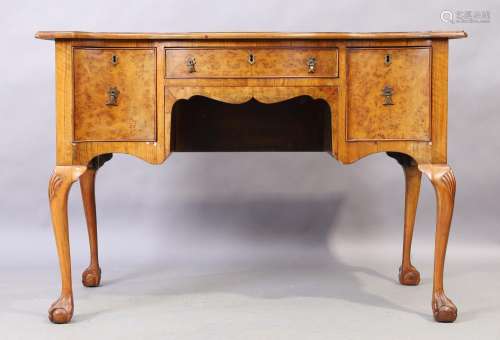 A George II style walnut serpentine front dressing table, ea...