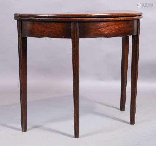 A George III mahogany demi lune tea table, last quarter 18th...