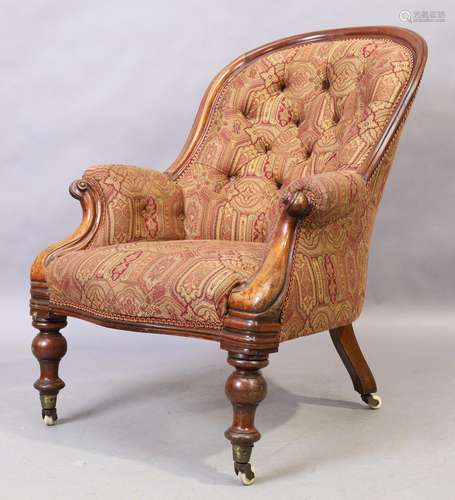 A Victorian mahogany spoon back armchair, third quarter 19th...