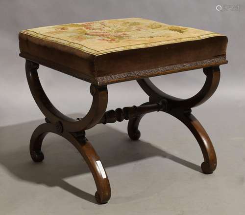 A Victorian mahogany X-framed stool, circa 1880, with floral...