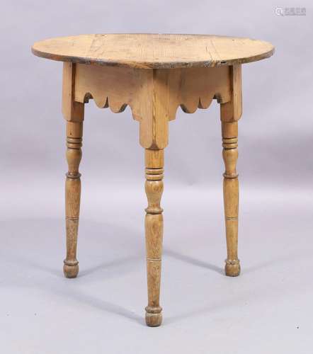 A Victorian pine cricket table, the circular top raised on t...