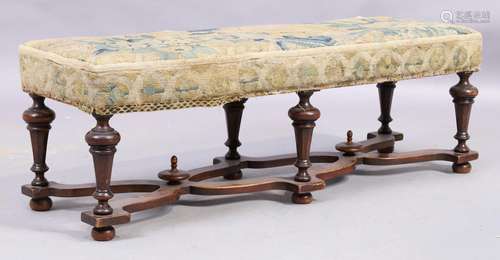 An English mahogany stool, 19th century, with floral tapestr...