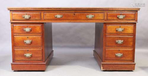An Edwardian mahogany pedestal desk, the tooled red leather ...
