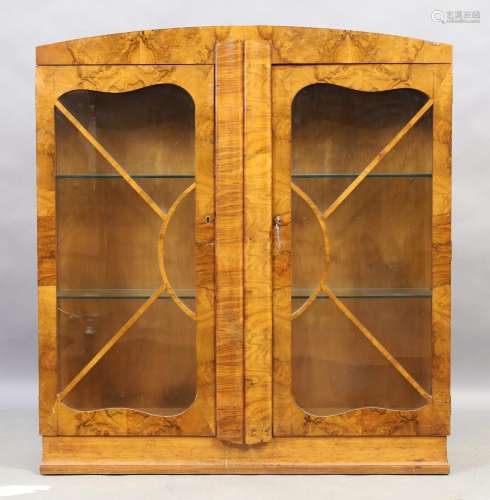 An Art Deco walnut display cabinet, early 20th century, the ...