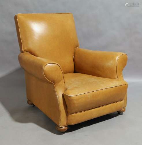 An early 20th century tan leather armchair, circa 1930, rais...