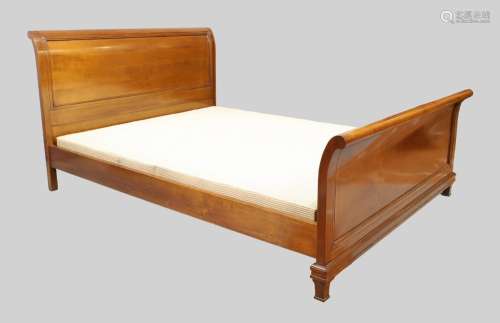 A modern mahogany sleigh bed, reputedly retailed by And so t...