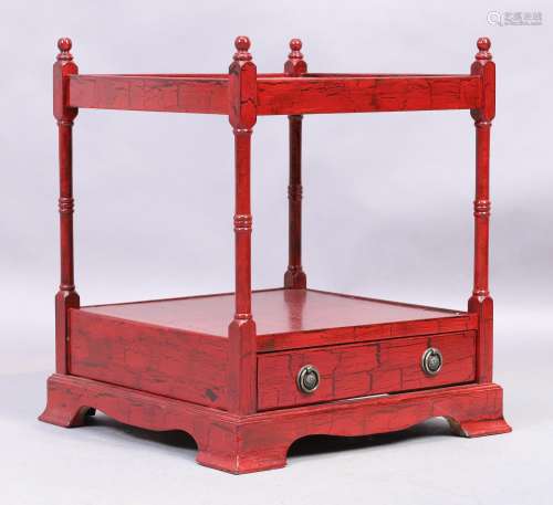 A modern red painted two tier whatnot, in the Regency taste,...