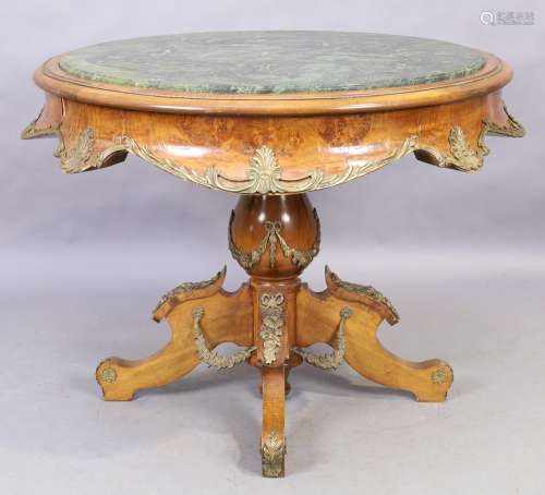 A French stained beechwood and walnut veneered center table,...
