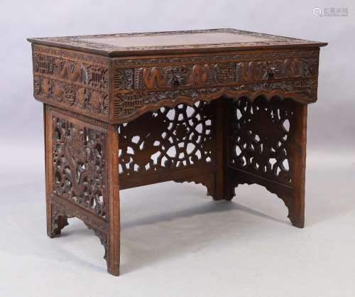A Chinese carved hardwood folding travel desk, late 19th cen...