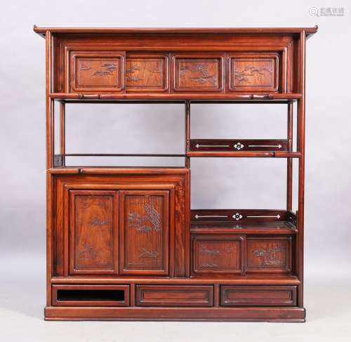 A Chinese hardwood cabinet, early 20th century, with sliding...