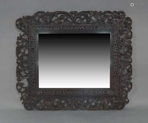 An Anglo-Indian stained teak mirror, early 20th century, car...