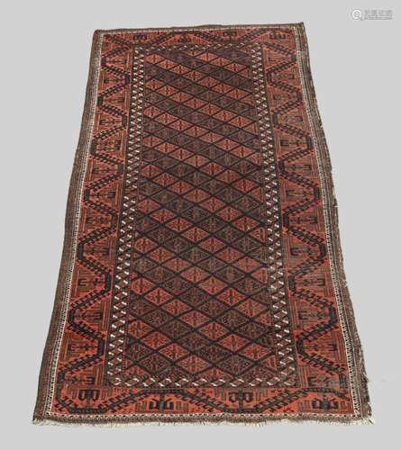 A Persian Belouch rug, second quarter 20th century, the cent...