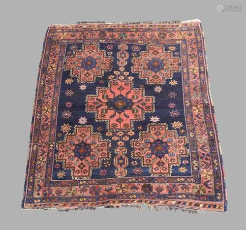 A Persian Turkoman rug, 20th century, five central geometric...