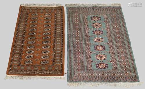 Two Bokhara rugs, 20th century, one on a terracotta ground, ...