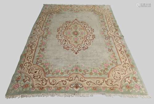 A woollen carpet, second quarter 20th century, floral design...