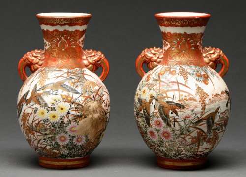 A pair of Japanese earthenware vases, Meiji period, enamelle...