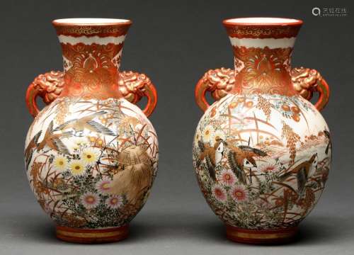 A pair of Japanese earthenware vases, Meiji period, enamelle...