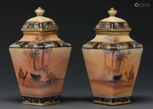 A pair of Noritake vases and covers, c1930, painted with con...