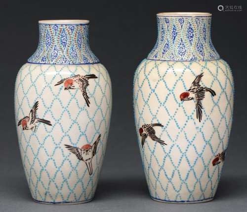 A pair of Japanese satsuma vases, decorated in the manner of...