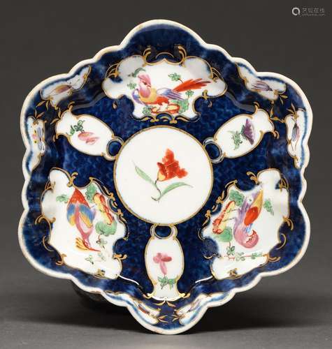 A Worcester scale blue ground teapot stand, c1770, painted w...