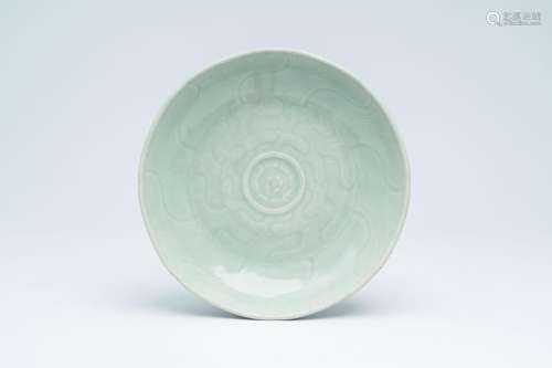 A Chinese celadon-glazed 'lotus' plate, Qianlong/Jiaqing<br ...