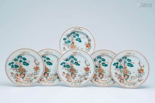 Six Chinese famille verte and gilt plates with floral design...