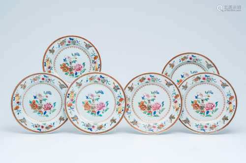 Six Chinese famille rose plates with a flower vase and butte...