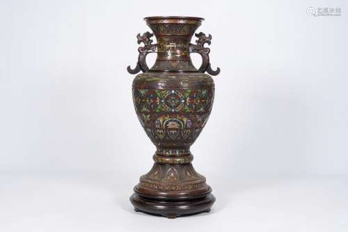 A large Japanese champleve vase with mountain landscapes and...